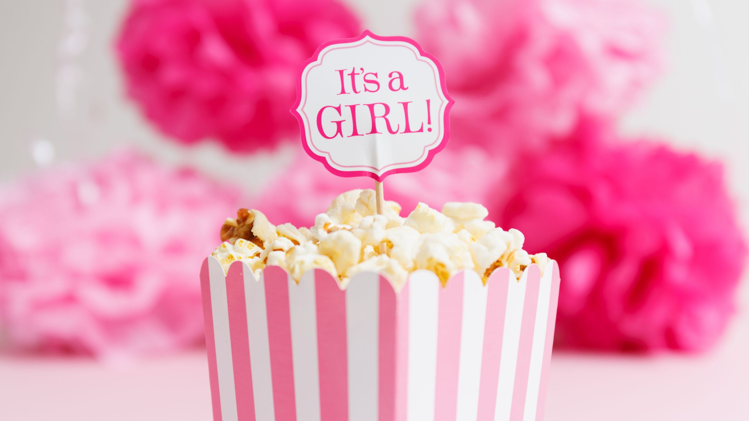 it s a girl sign in a popcorn bag at the baby shower party paper flowers background baby shower celebration concept a7e b02a4fd78a a00
