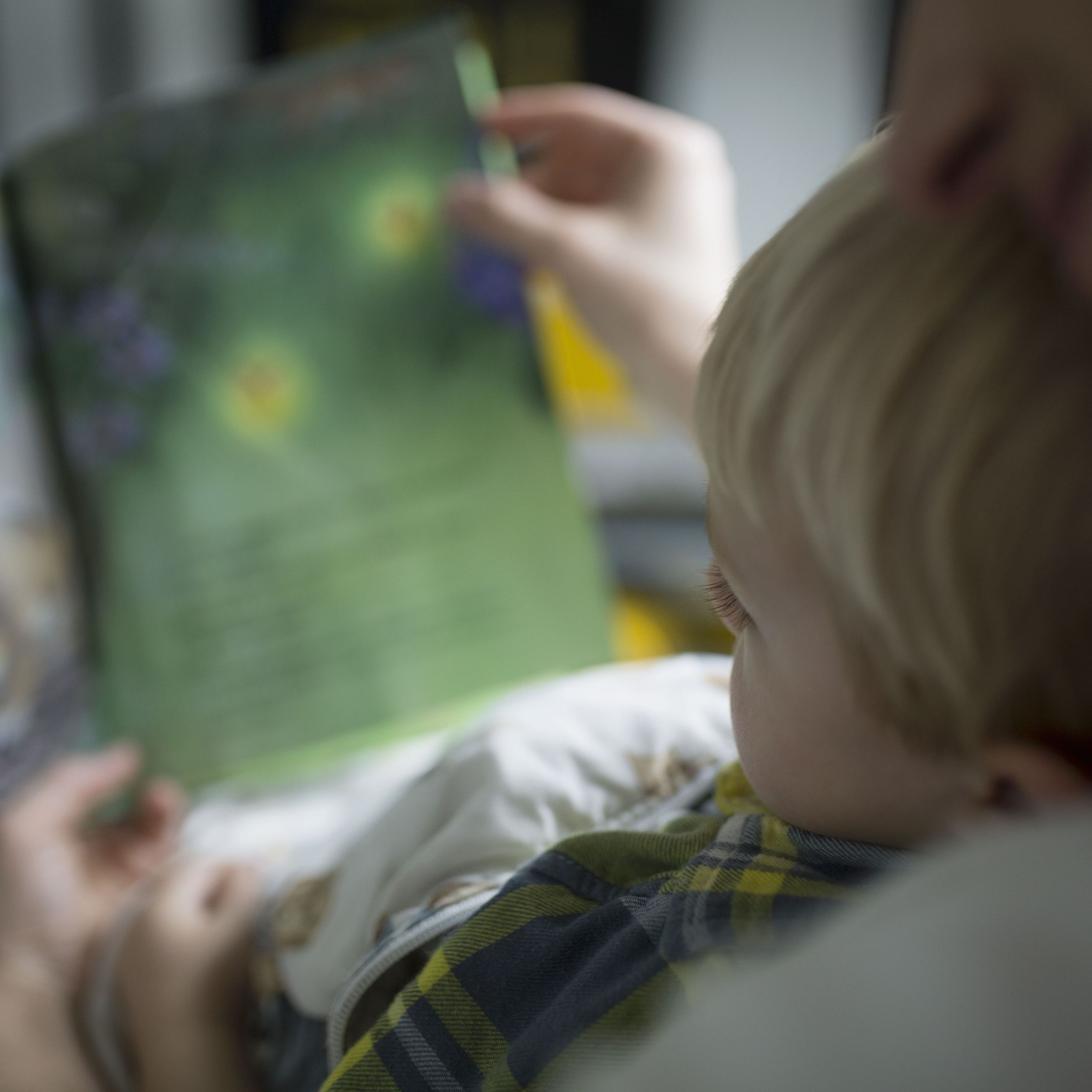 close up mother and son reading book 57a8d6033df78cf4593ba26c