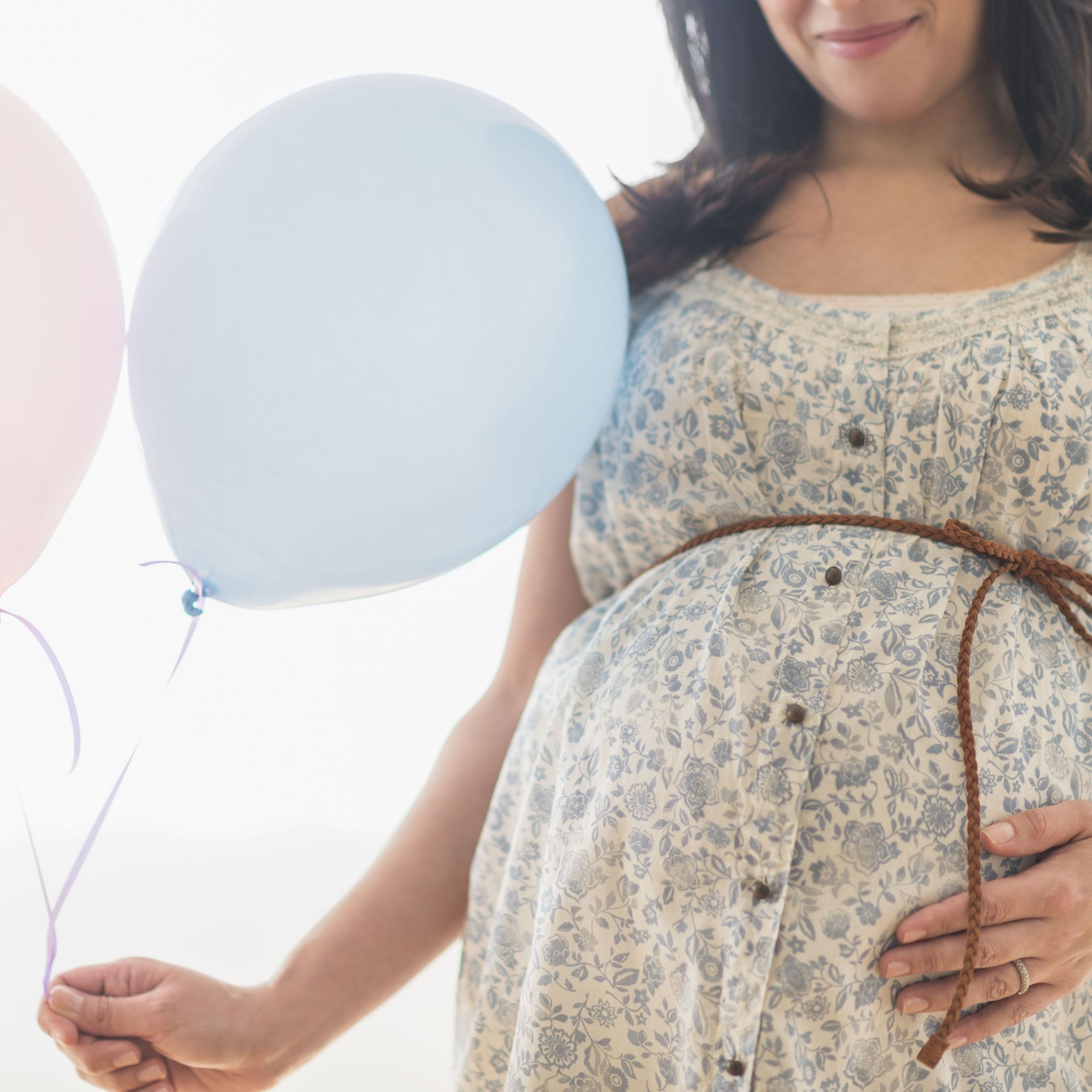 pregnant hispanic woman carrying balloon 57e9416a3df78c690f3066b3